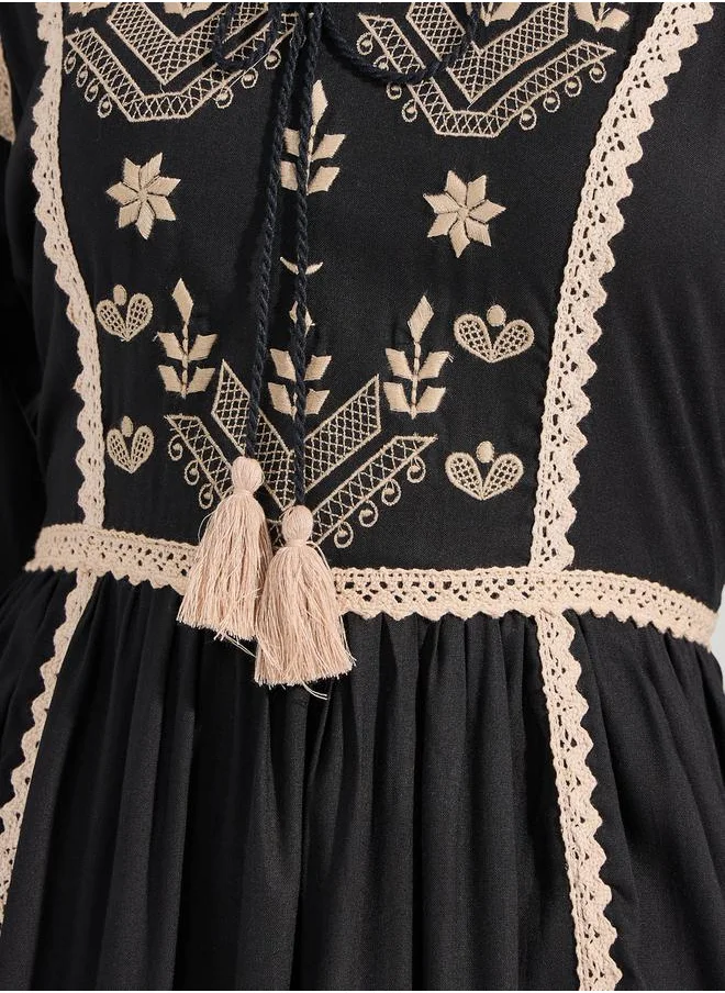 ستايلي Embroidered Yoke Tasseled A-Line Midi Dress