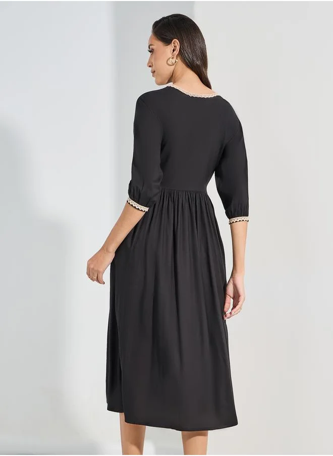 ستايلي Embroidered Yoke Tasseled A-Line Midi Dress