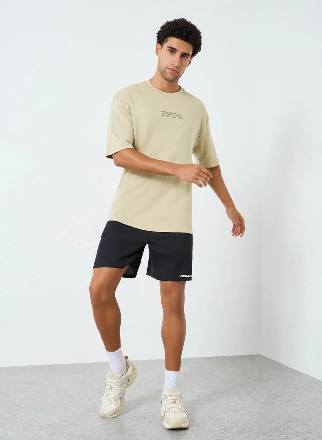Styli Active Men Oversized Minimal Front Print T-Shirt