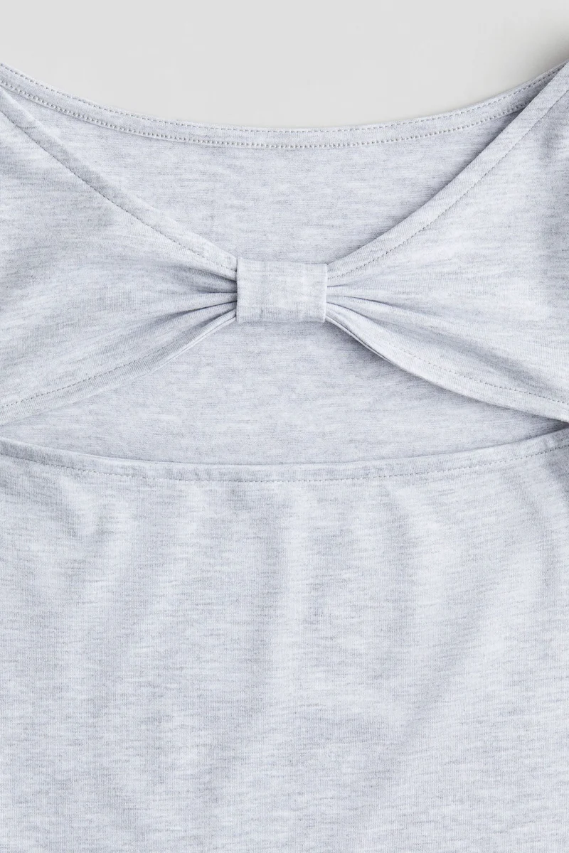 اتش اند ام بلوزة جيرسيه بثقوب مفرّغة