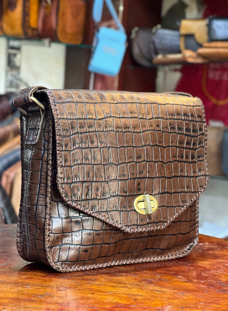 Men’s Handmade Leather Bag – Durable and elegant, designed for daily needs and lasting use.  ✔️ 100% genuine leather ✔️ Expert handmade craftsmanship ✔️ 3 zippered compartments for organization ✔️ Adjustable shoulder strap ✔️ Secure metal clasp closure ✔️ Soft velvet inner lining for protection 📏 Size: 30×30 cm – Large size  🧵 Strong and functional for everyday use 🎯 Ideal for work, travel, or casual outings 🛡️ Premium quality + warranty + after-sale support  🎁 Order now and experience long-lasting leather quality ⭐ Loved it? Leave us a review – your opinion matters!  #MensBag #LargeLeatherBag #HandmadeLeather #GenuineLeather #LeatherCraft #2025Style #AdjustableStrap #EgyptianMade #LeatherAccessories - Image 1