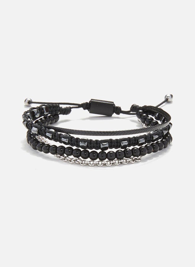 CHRYSOSTOMOS Handmade Adjustable Beaded Multi-Line Bracelet with Glossy Black Onyx, Squared Hematite, Macrame Binding and Black Cord - Image 1