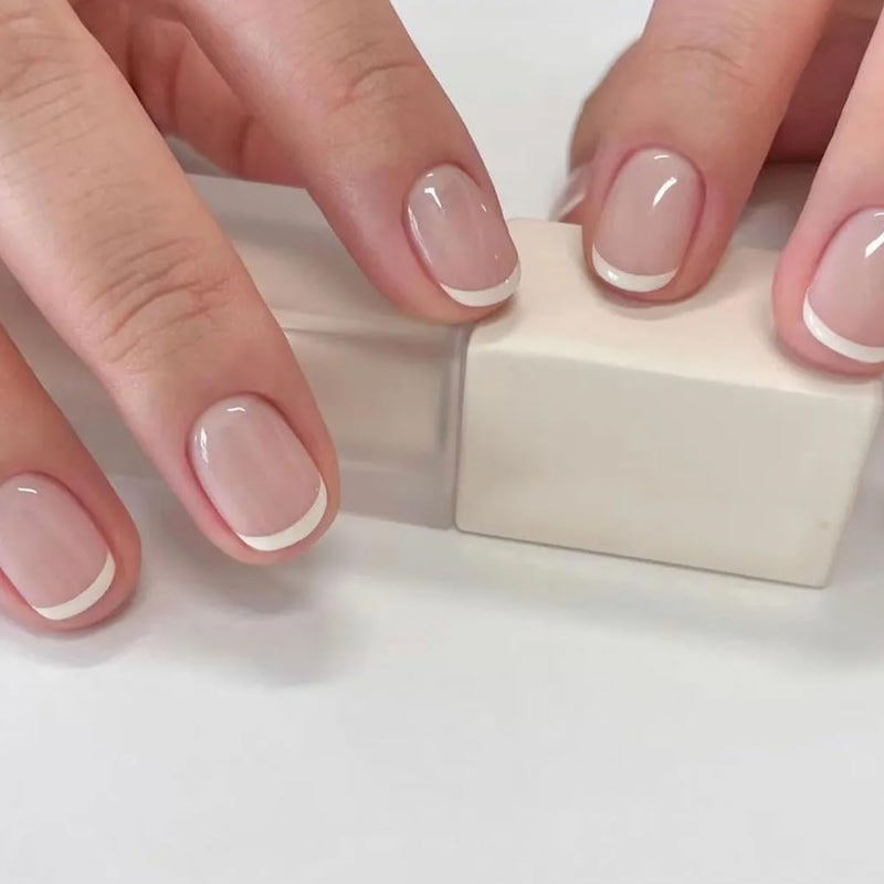 OCOUYVD Petite Press on Nails Extra Short French Tip Fake Nails Nude Stick on Nail Cute French Tip Glue Nails Gloss False Nails Reusable Artificial Nail for Women Manicure Art - Image 1
