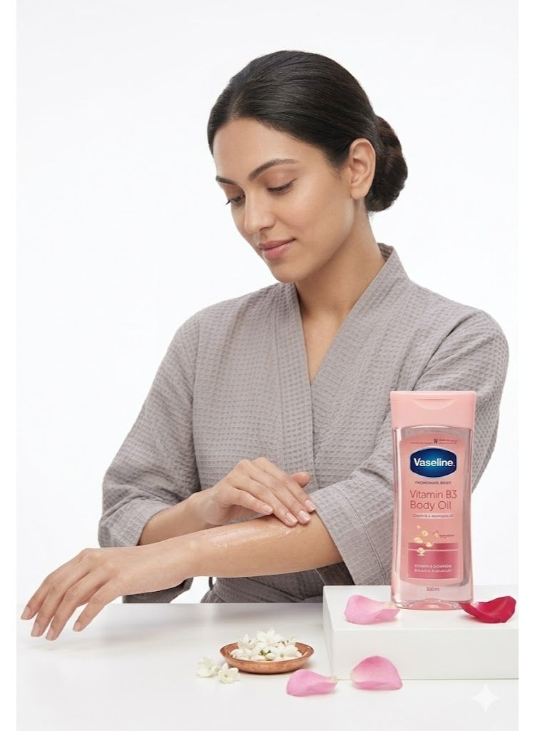 فازلين زيت الجسم فازلين إنتينسيف كير الوردي - فازلين بودي أويل بفيتامين B3 لترطيب وتفتيح البشرة ومعالجة جلد الإوزة - 200 مل - Image 1