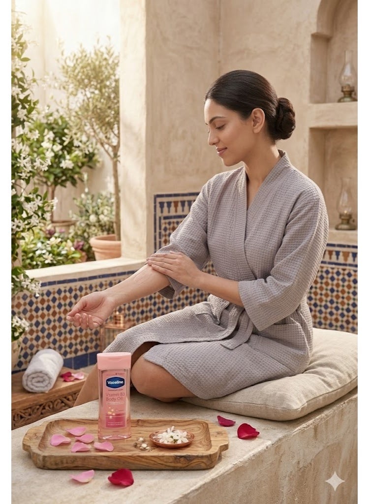 فازلين زيت الجسم فازلين إنتينسيف كير الوردي - فازلين بودي أويل بفيتامين B3 لترطيب وتفتيح البشرة ومعالجة جلد الإوزة - 200 مل - Image 4