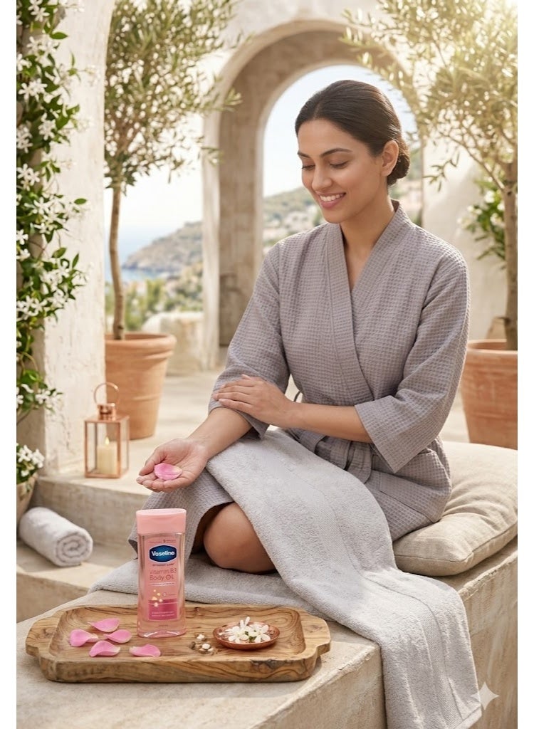 فازلين زيت الجسم فازلين إنتينسيف كير الوردي - فازلين بودي أويل بفيتامين B3 لترطيب وتفتيح البشرة ومعالجة جلد الإوزة - 200 مل - Image 2