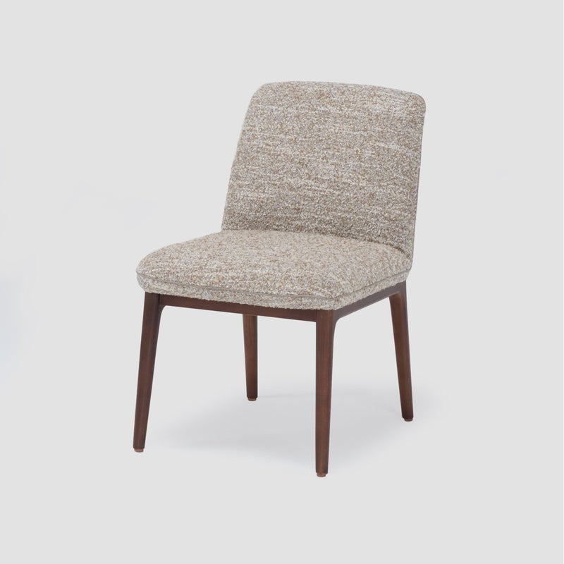 AL HUZAIFA FURNITURE Jozi Armless Dining Chair, Upholstered In Fabric With Wooden Legs - Image 1