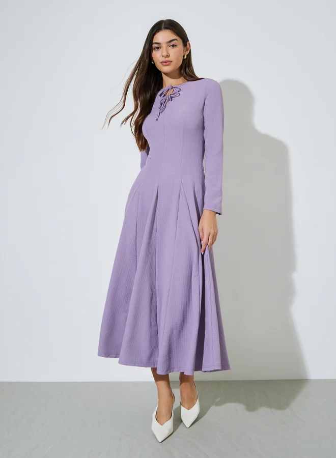 Styli Lilac Textured Pleated Details Tie-Up Neck A-Line Maxi Dress
