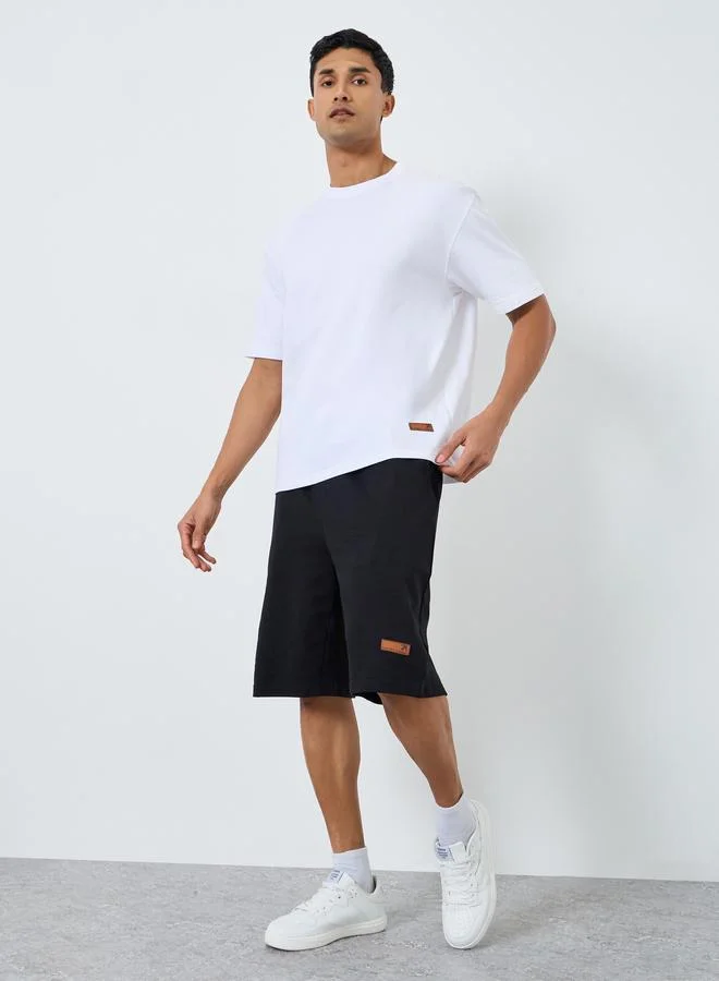 Styli Men Oversized Badge Detail T-Shirt and Shorts Co-Ords