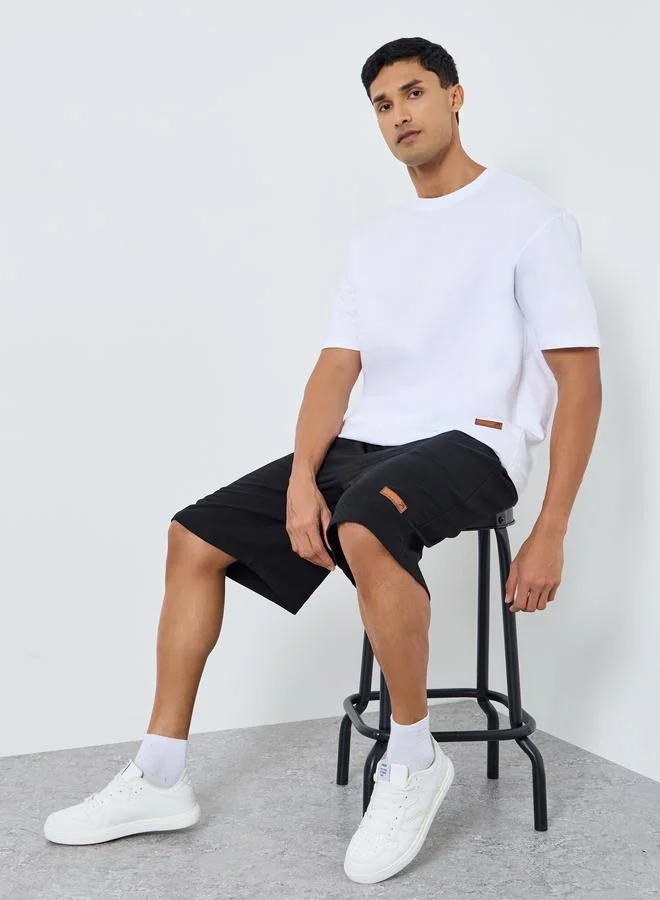 Styli Men Oversized Badge Detail T-Shirt and Shorts Co-Ords
