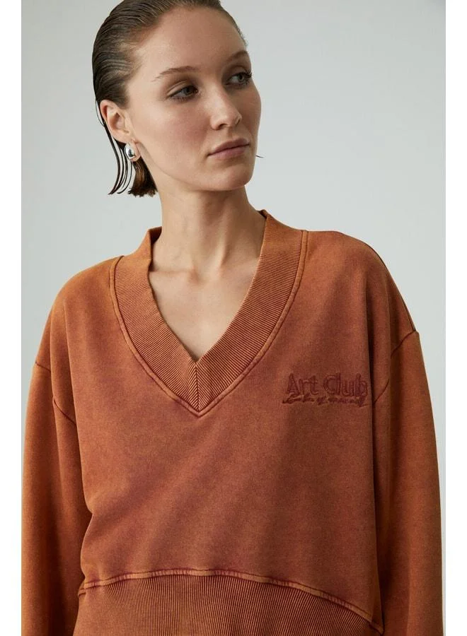 GRIMELANGE ANDREITA Women's V-Neck Asymmetric Oversize Orange Sweatshirt.