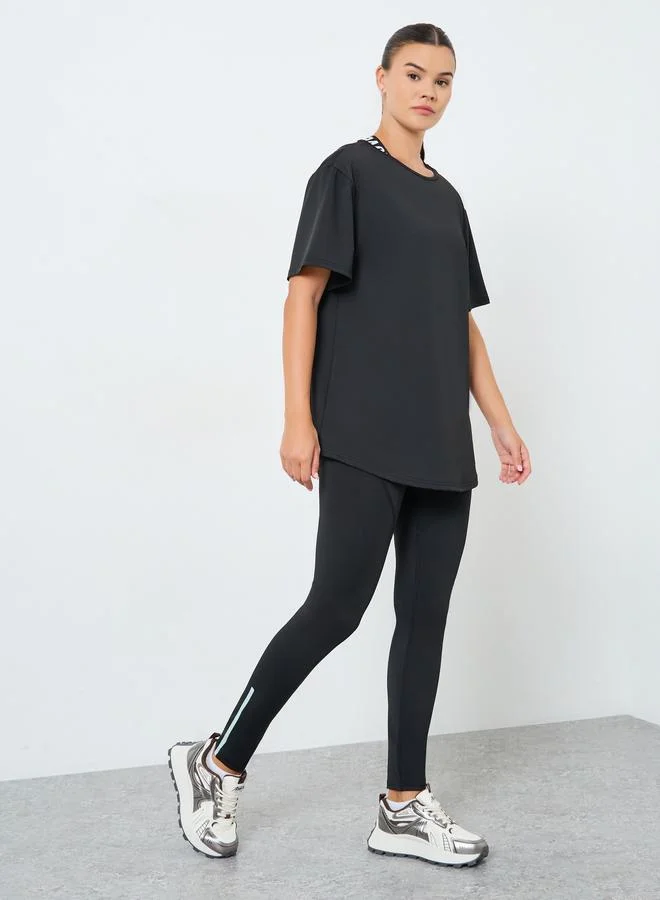 Styli Active Pack of 3 - Mesh Panel T-Shirt, Crossback Strap Sports Bra and Stitch Detail Leggings