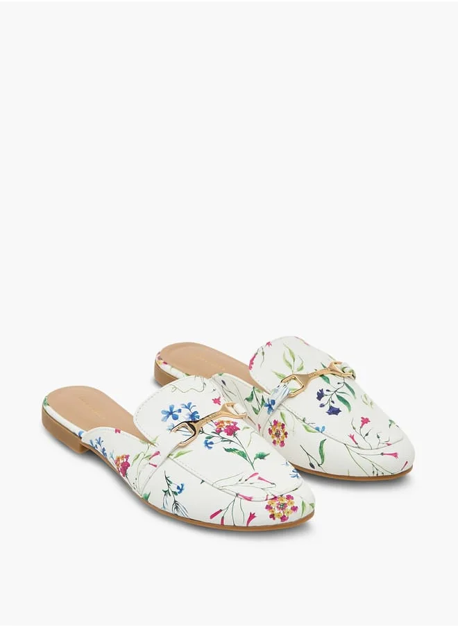 فلورا بيلا من شو إكسبرس Women's Floral Print Slip-On Mules with Metallic Accent