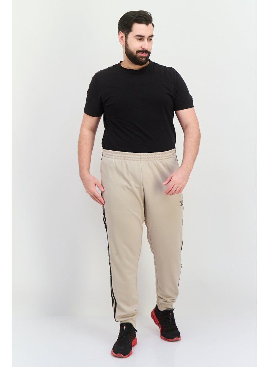 adidas Originals - Men Sportswear Fit Embroidered  Logo Outdoor Sweatpants, Beige - Image 1