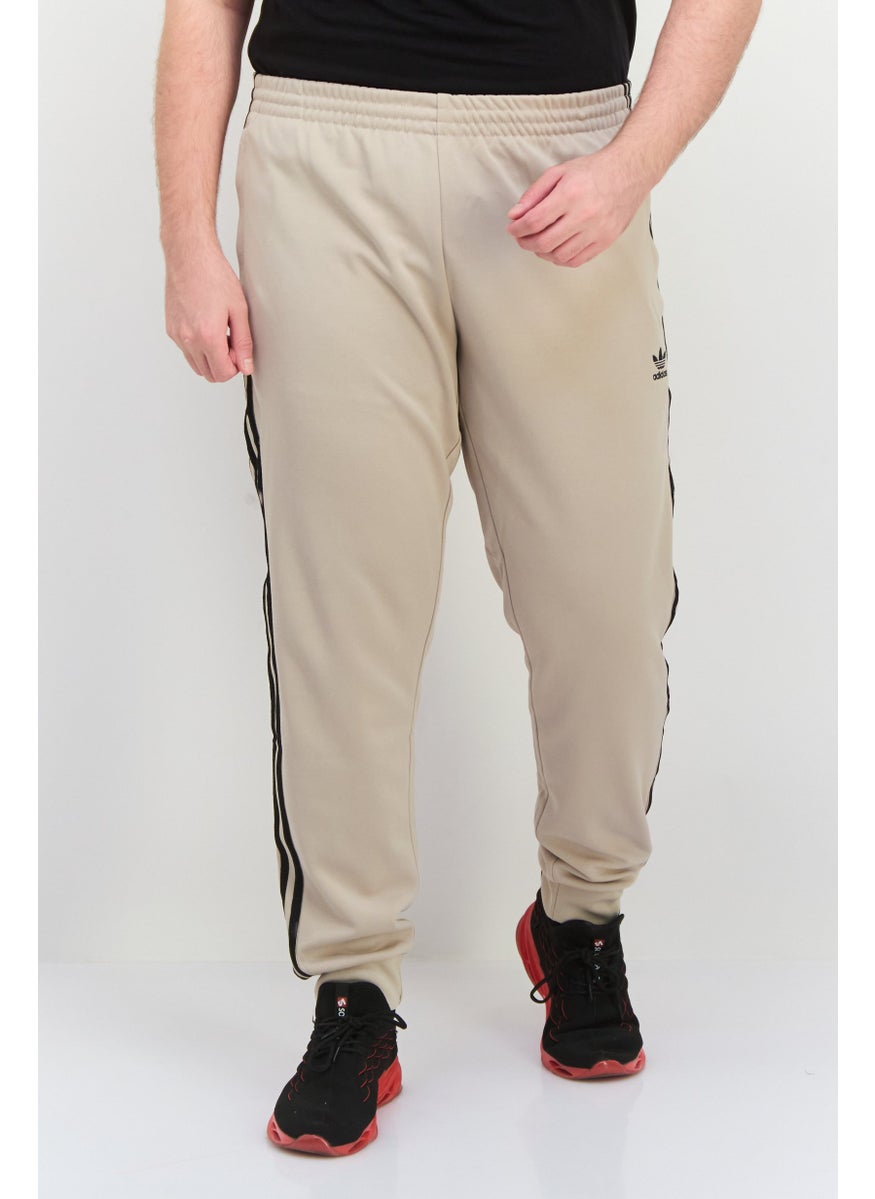 adidas Originals - Men Sportswear Fit Embroidered  Logo Outdoor Sweatpants, Beige - Image 1