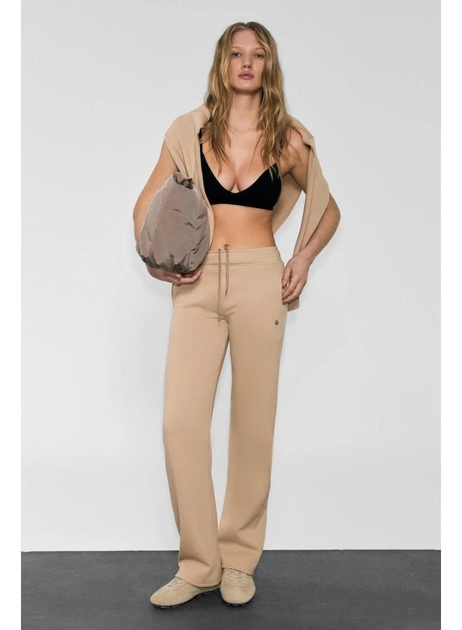 URBAN BEAT CLAYT Women's Fleece-Lined Soft-Fabric Double-Pocket Relaxed Mink Sweatpants with Print Details.
