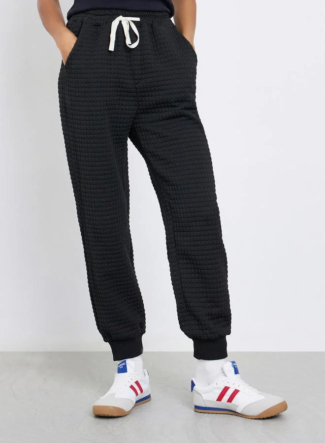 Styli Women Black Textured Loose Fit Cuffed Joggers