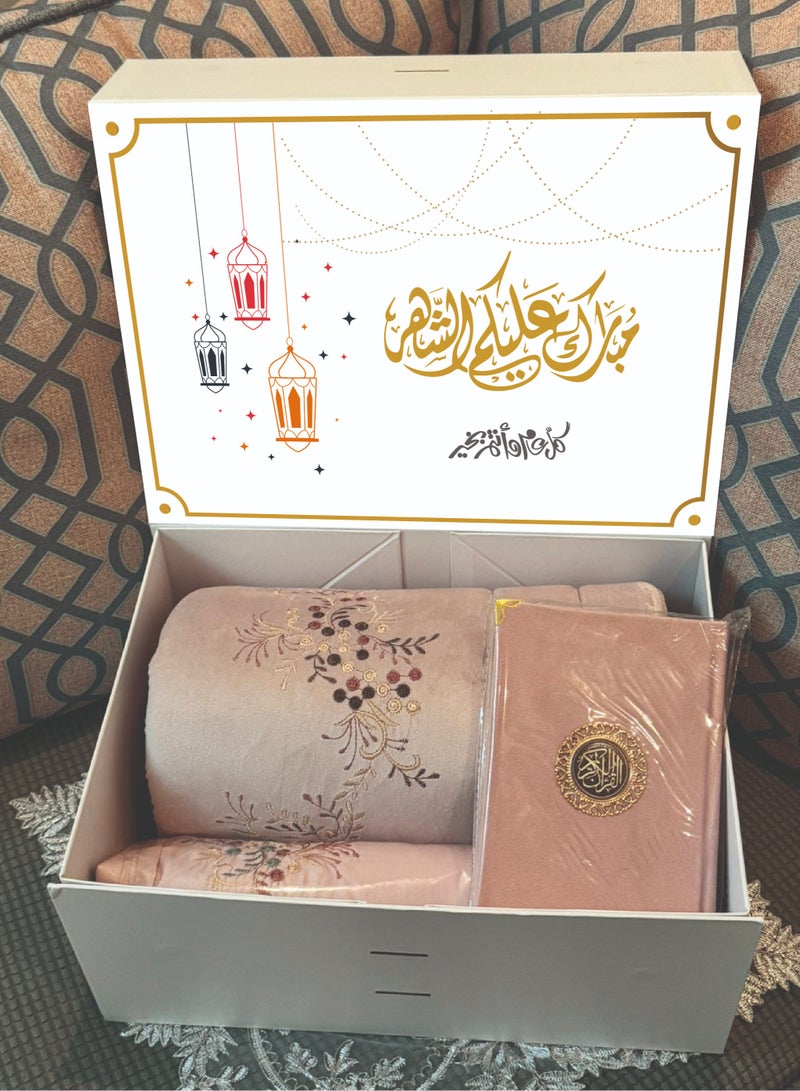 A set of carpet, prayer sheet and Qur’an for women