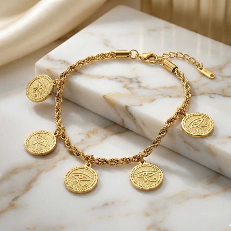 An elegant gold bracelet made of rust-resistant stainless steel, with a braided chain from which five coins with the Eye of Horus dangle, a design that highlights your look, with an adjustable clasp to suit you. - Image 3