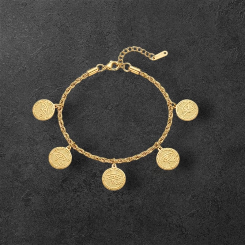 An elegant gold bracelet made of rust-resistant stainless steel, with a braided chain from which five coins with the Eye of Horus dangle, a design that highlights your look, with an adjustable clasp to suit you. - Image 5