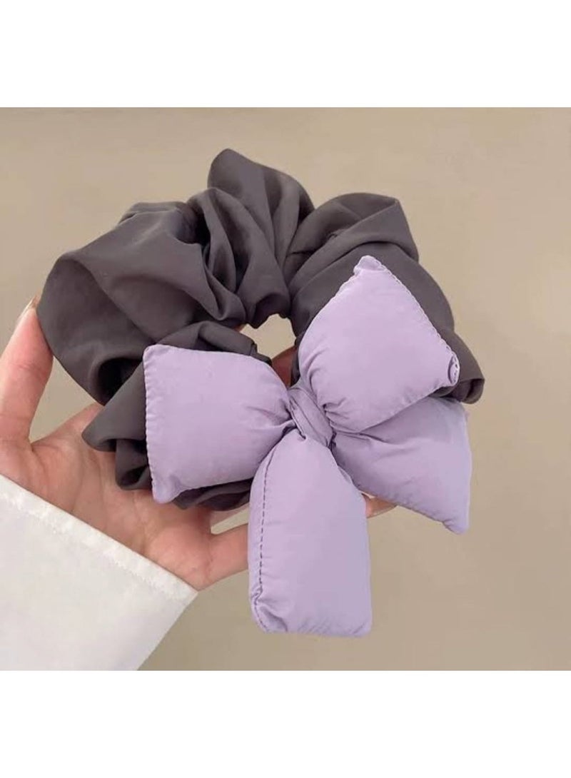 : Women’s hair tie with a new trendy design, featuring a padded and three-dimensional bow, made in bright and different colors, soft and lightweight on the hair, suitable for daily use and special occasions, and adds an elegant and modern touch to the look. - Image 1