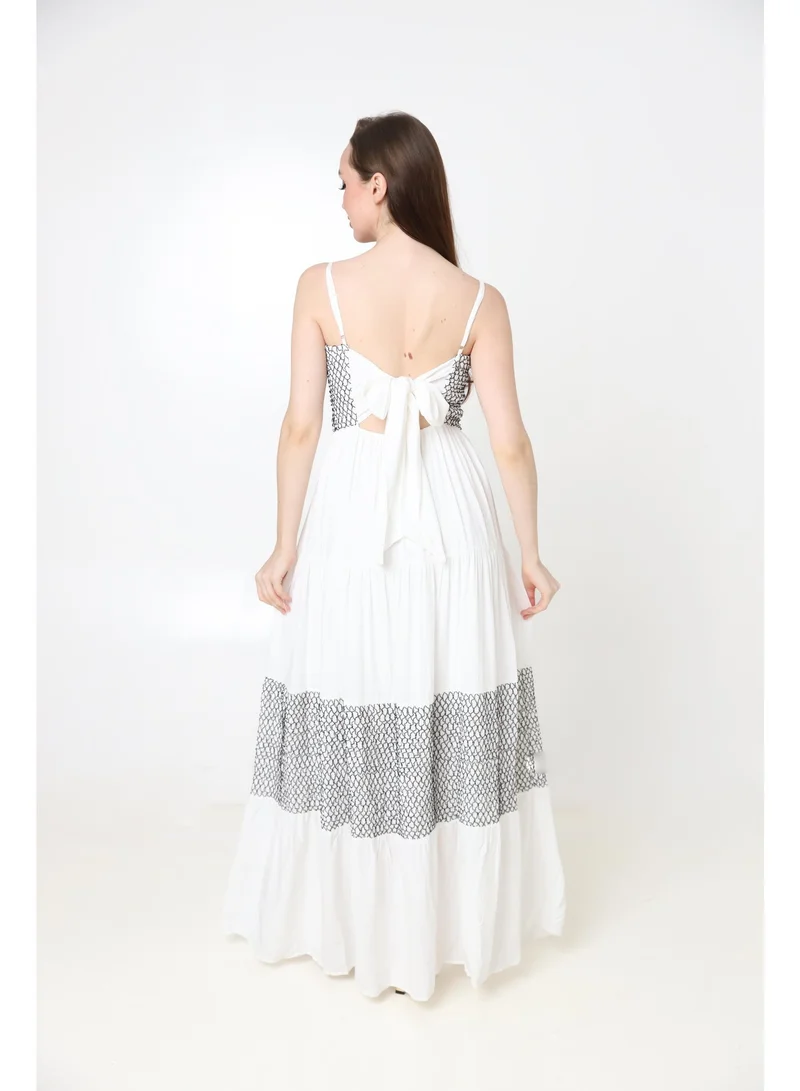 2Trendy Women's White Maxi Dress with Thin Straps, Black Embroidery and Tie Back