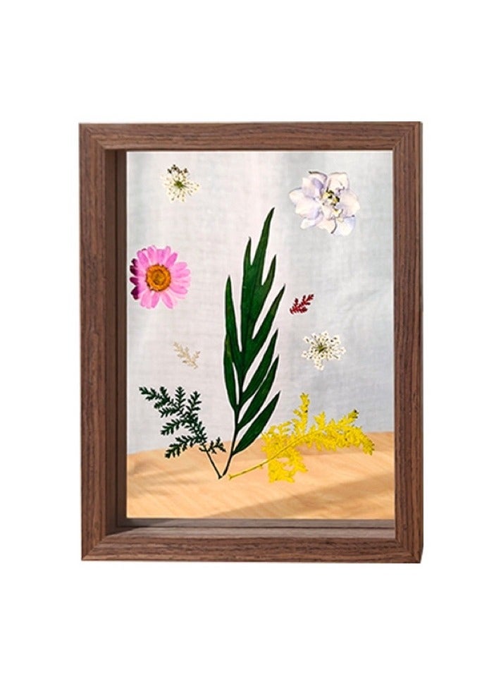 A picture frame with leaves visible from both sides in dark brown in different sizes
