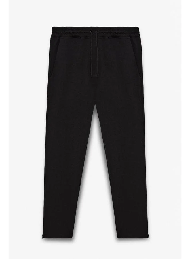 GRIMELANGE LAMARE Men's waist-elastic, side-pocket, regular fit black sweatpants.