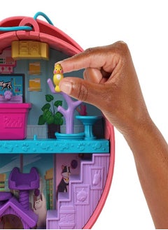 Polly Pocket Polly Pocket Starring Shani Cuddly Cat Purse, Pet Vet Theme with 2 Micro Dolls & 18 Accessories, Pop & Swap Peg Feature, Great Gift for Ages 4 Years Old & Up  - Image 2