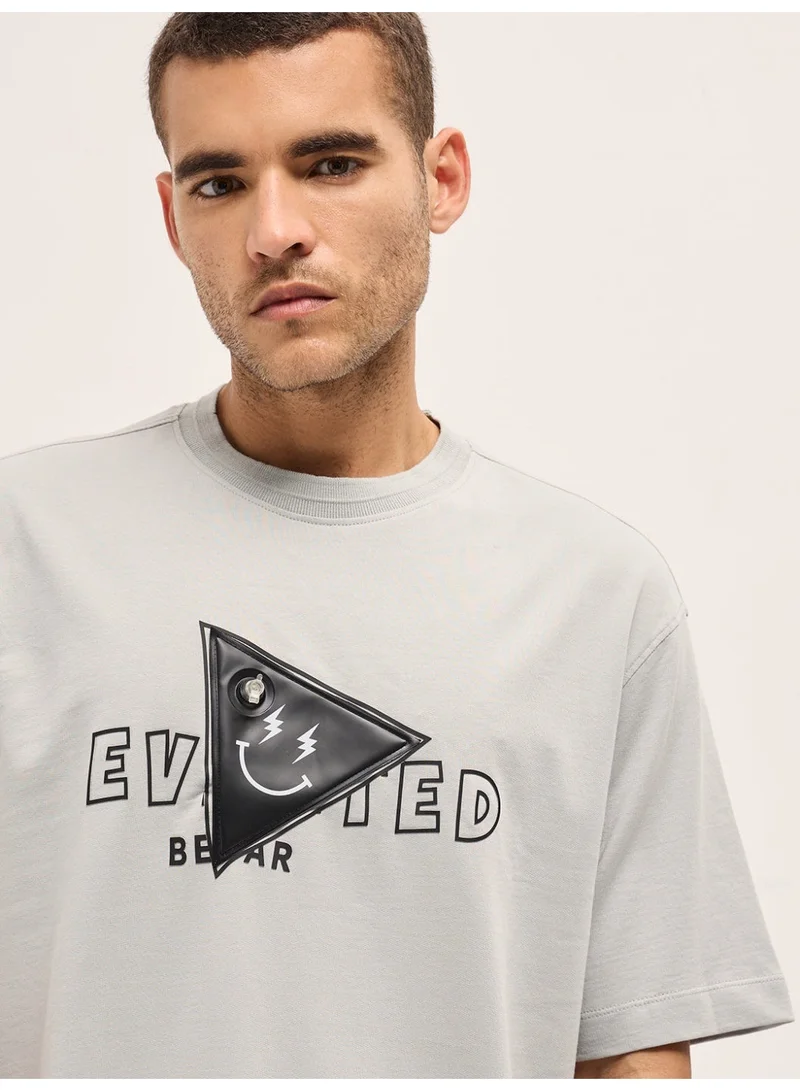 The Bear House  Men's Light Grey Patch Graphic Printed Oversize Crew Neck T-shirt Perfect For Casual Wear, Gym, Travel, Or Layering Stylish And Versatile Essential For Every Wardrobe for Men | Best Price UAE