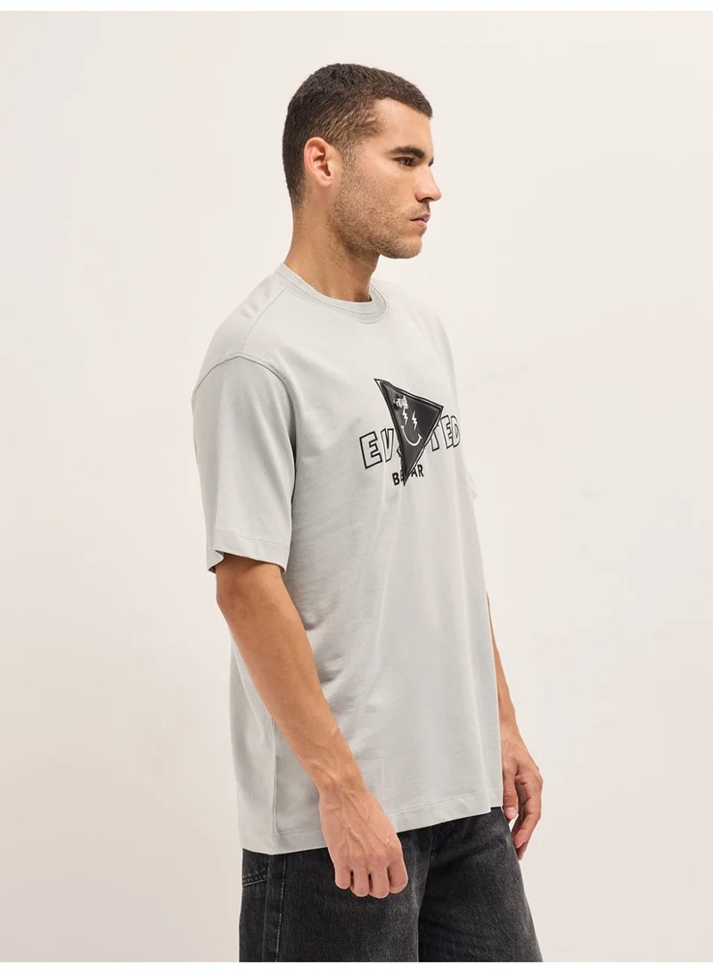 The Bear House  Men's Light Grey Patch Graphic Printed Oversize Crew Neck T-shirt Perfect For Casual Wear, Gym, Travel, Or Layering Stylish And Versatile Essential For Every Wardrobe for Men | Best Price UAE