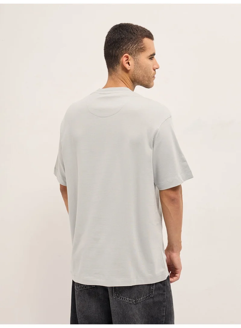The Bear House  Men's Light Grey Patch Graphic Printed Oversize Crew Neck T-shirt Perfect For Casual Wear, Gym, Travel, Or Layering Stylish And Versatile Essential For Every Wardrobe for Men | Best Price UAE