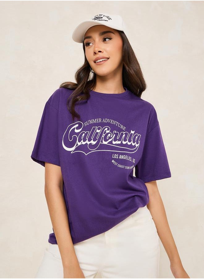 Styli Oversized California Slogan Print Round Neck T-Shirt  - Image 1