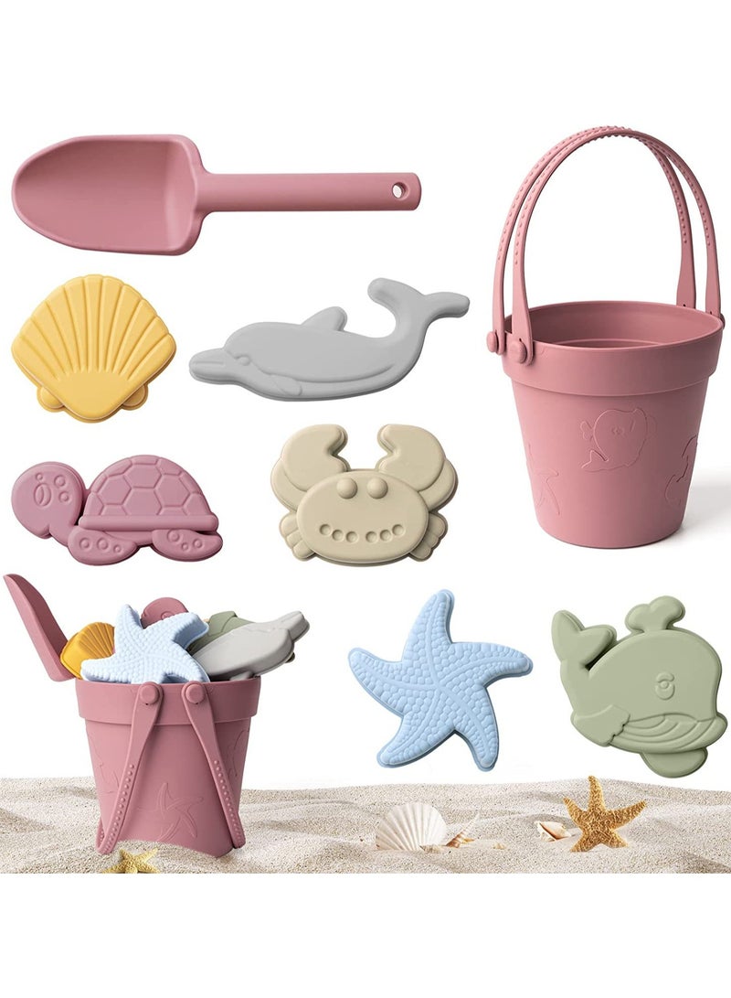 جورونب ٩ قطع من ألعاب الشاطئ المصنوعة من السيليكون، مع دلو رمل، مجرفة، ٦ قوالب ثلاثية الأبعاد بطابع بحري، وحقيبة شاطئ شبكية محمولة، مجموعة ألعاب رمل خارجية للأطفال الصغار، من ٣ إلى ٨ سنوات (بنفسجي وردي) - Image 1