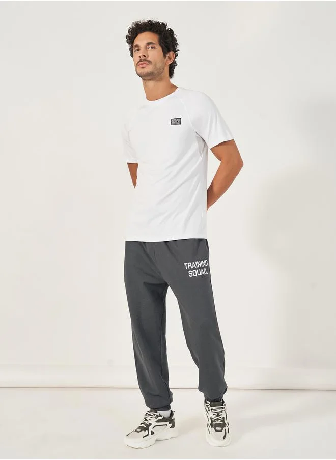 ستايلي Eco Earth Slogan Print Oversized Training Joggers