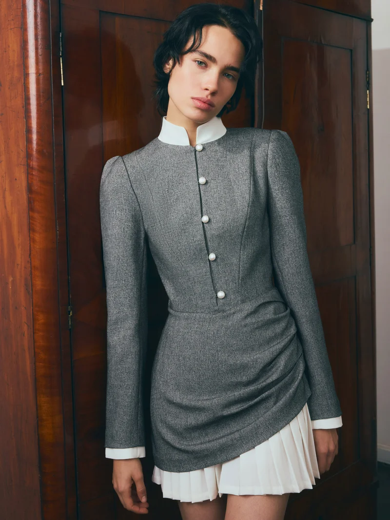 Lichi Mini dress with a pleated skirt and pearl buttons