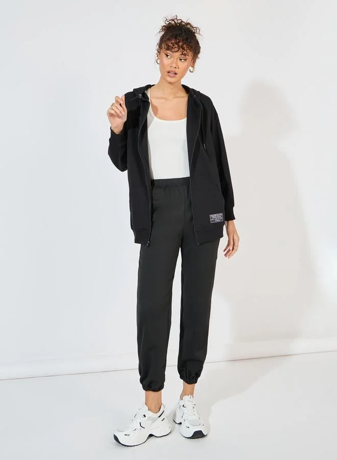 Styli  Oversized Zip Through Hoodie with Badge Detail for Women | Best Price UAE