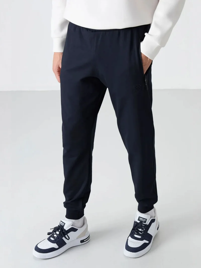 تومي لايف TOMMY Men's Solid Pull-on Sweatpants With Zip Pocket
