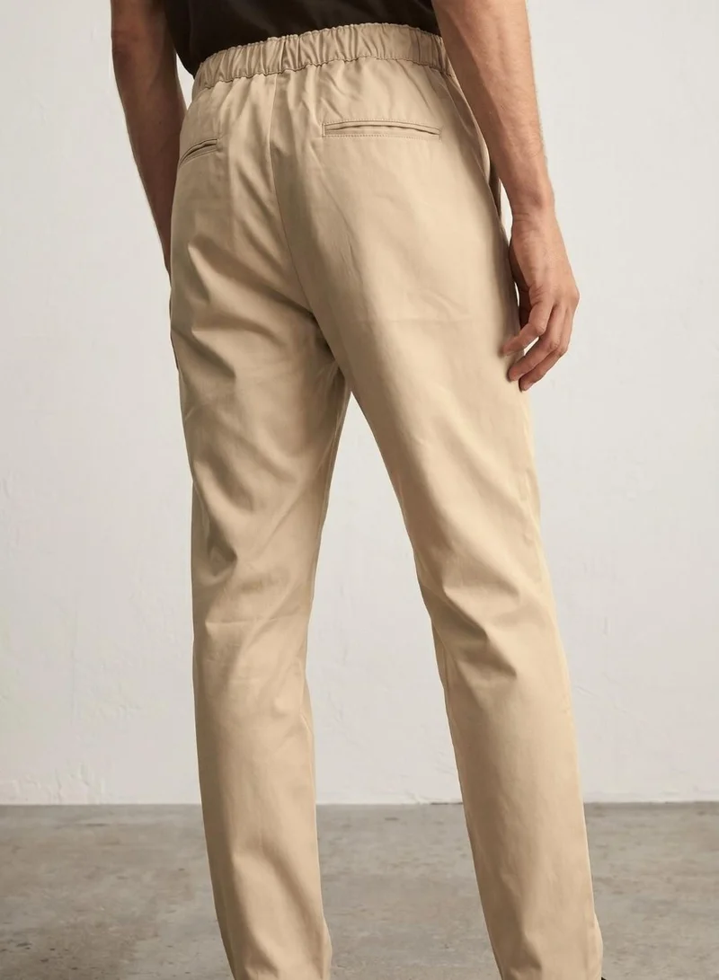 Dennis Lingo  Men Beige Lycra Solid Full Casual Relaxed Trouser for Men | Best Price UAE