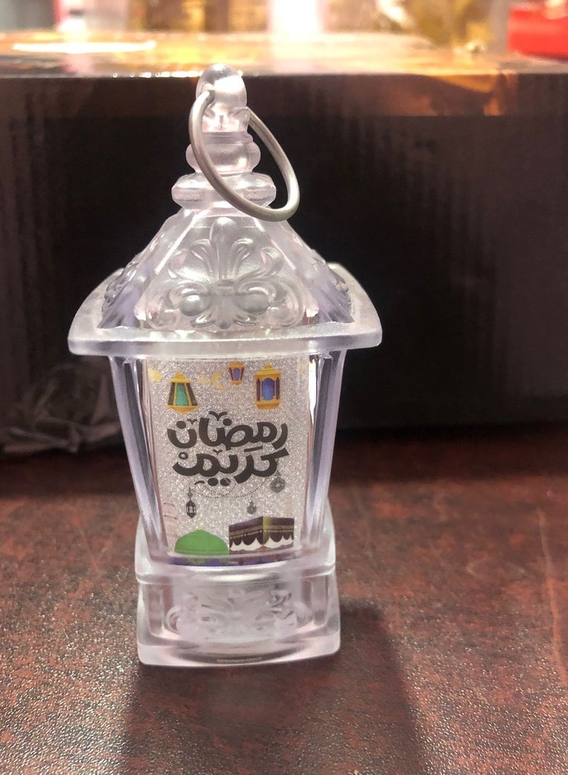 فانوس رمضان مضئ مزود بحامل للديكور شكل عصري وخامات عالية الجودة اضاءة ملونة وصور رمضانية وعبارات (شفاف 1 ) طول ١٠ سم  - Image 3