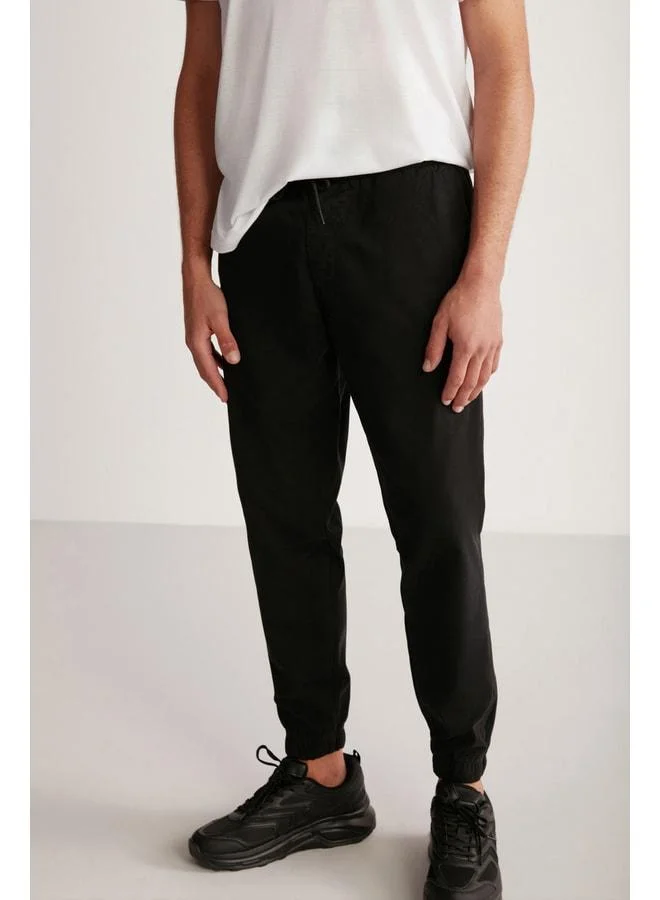 GRIMELANGE Jakob Men's Woven Washable 4-Pocket Thick-Textured Elastic Black Pants.