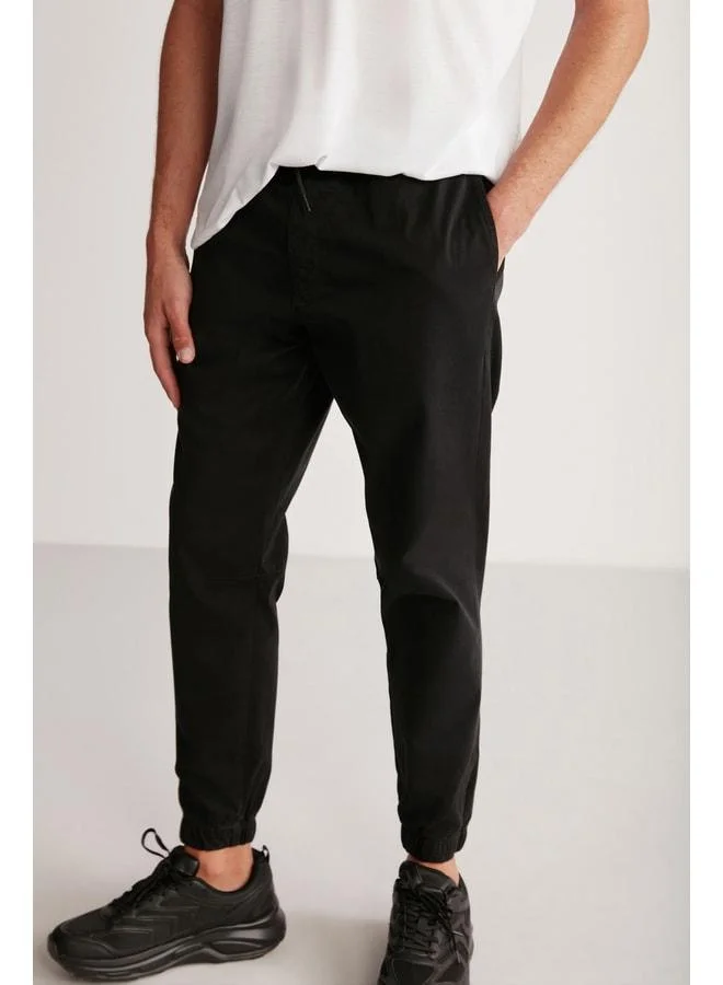 GRIMELANGE Jakob Men's Woven Washable 4-Pocket Thick-Textured Elastic Black Pants.