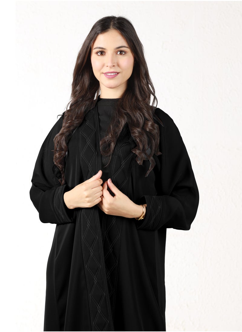 Black abaya with white threads on the sleeves and collar - pzsku/Z500BA5D077C2677B74B9Z/45/_/1709372090/70de3652-59a2-4697-9bb9-2c15a31e48a9