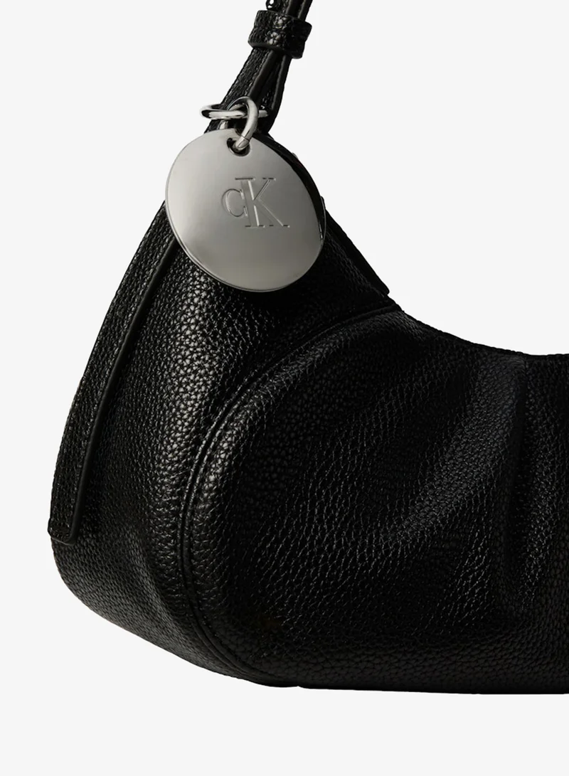 Calvin Klein  Plaque Charm Pebble Grain Crossbody Bag for Women | Best Price UAE