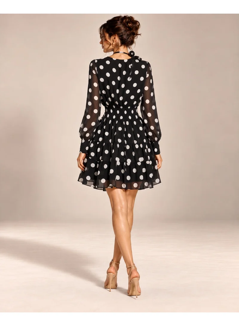 2Trendy Women's Black Mini Polka Dot Dress with V Neckline, Sheer Sleeves and Tiered Skirt