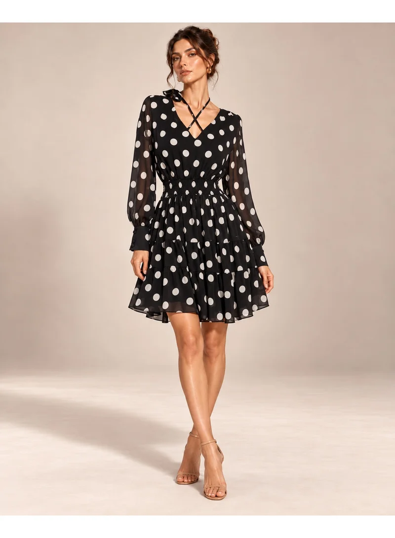 2Trendy Women's Black Mini Polka Dot Dress with V Neckline, Sheer Sleeves and Tiered Skirt