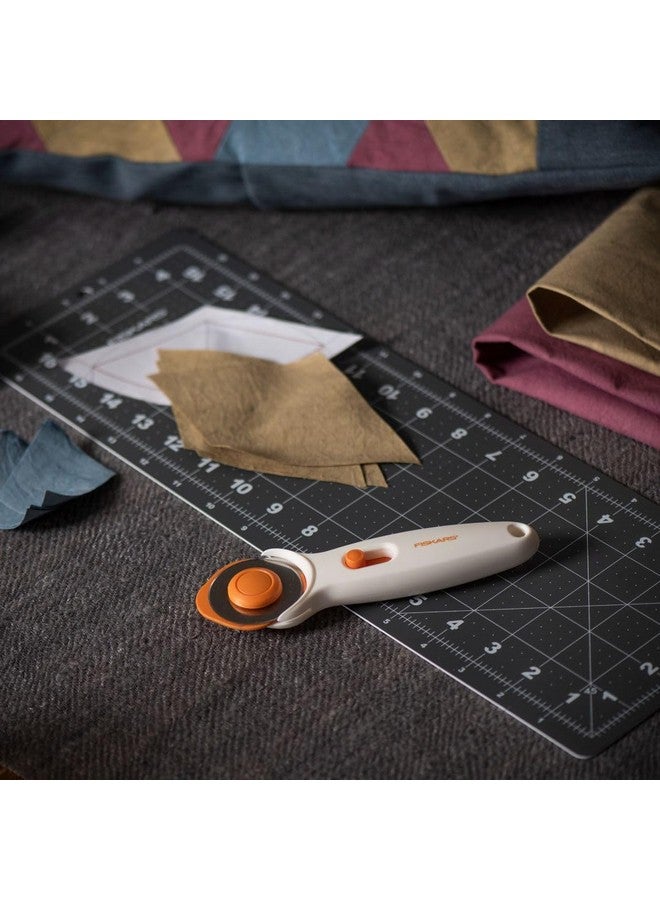 Fiskars 45mm Rotary Cutter for Fabric, Premium Steel Stick Fabric Cutter Cuts Through Multiple Layers, Right and Left Handed, Easy and Safe Blade Change, Arts and Crafts, Sewing and Quilting Tools - Image 4