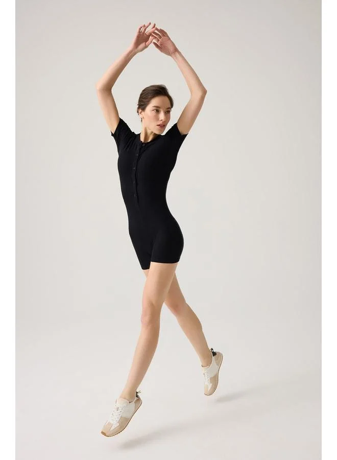 Los Ojos Black Ribbed Short‑Sleeve Short Jumpsuit (Short Romper).