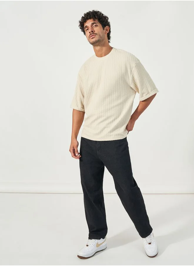 Styli Seersucker Textured Knit Boxy Fitted T-Shirt with Turn-Up Sleeves