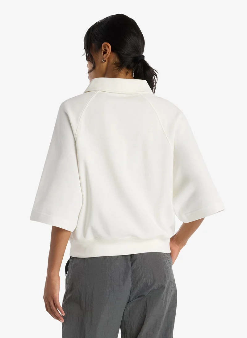 New Balance  Coastal Fleece Oversized Polo for Women | Best Price UAE